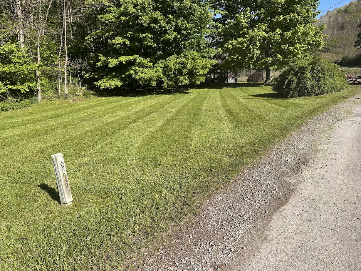 Freshly mowed lawn with crisp stripes in front of a Chillicothe, OH home